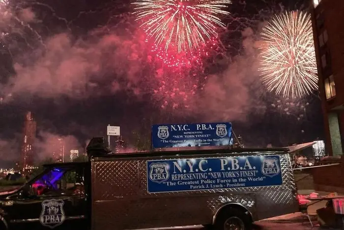 A photo of a PBA van at a private fireworks viewing party for the NYPD